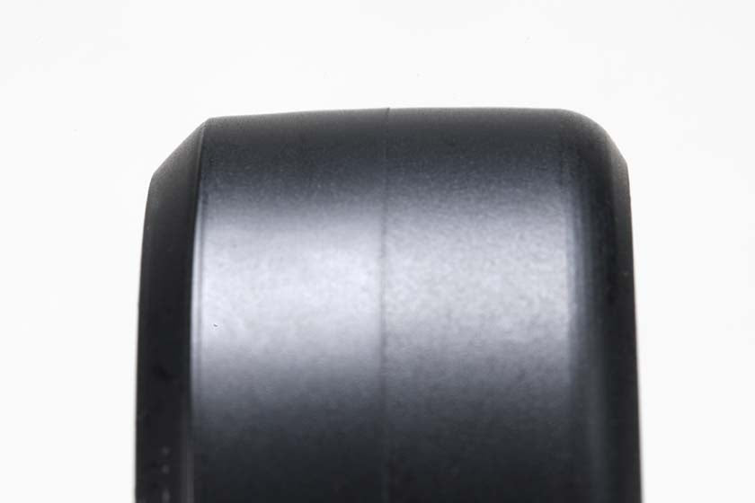 Up close top view of a DRP Drift Comp.Tire for P Tile on a white background