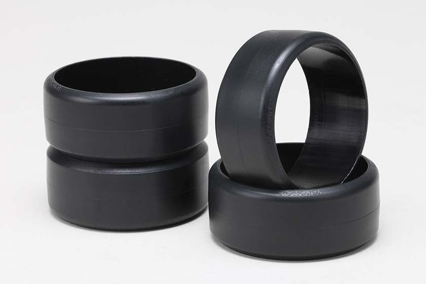 Set of four DRP Drift Comp.Tire for P Tiles stacked on a white background