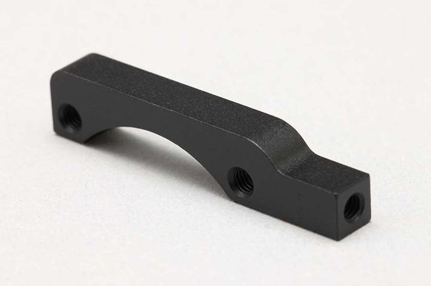 A close up side view of a Cooling Fan Stay for DP-YD2S by Yokomo on a white background