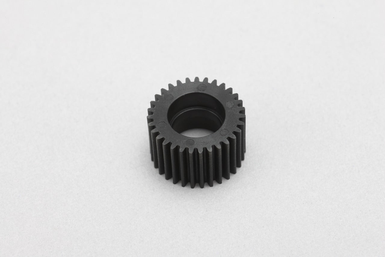 front up close view of an Idler Gear for YD-2 by yokomo on a grey background