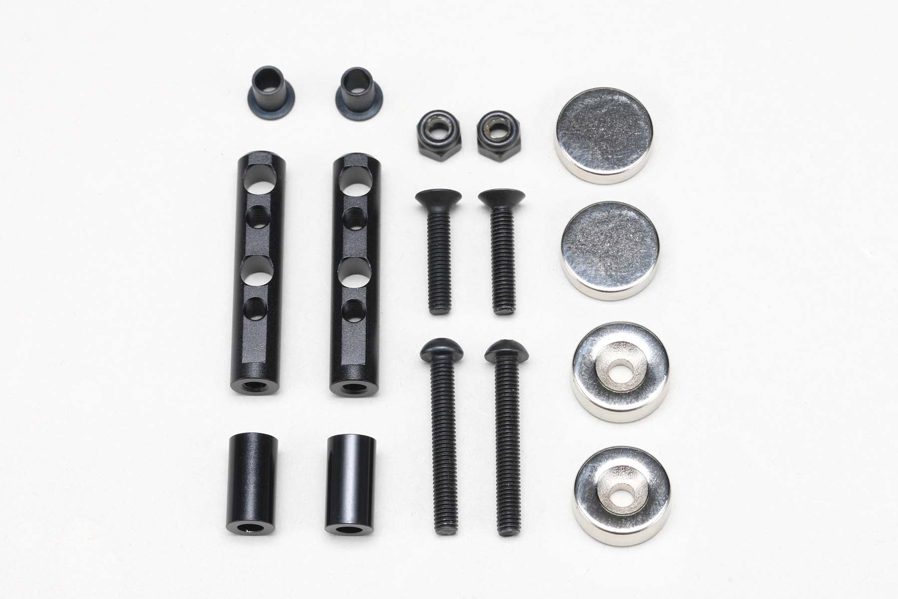 Parts of a Magnet Rear Body Mount for All-Purpose by Yokomo on a white background