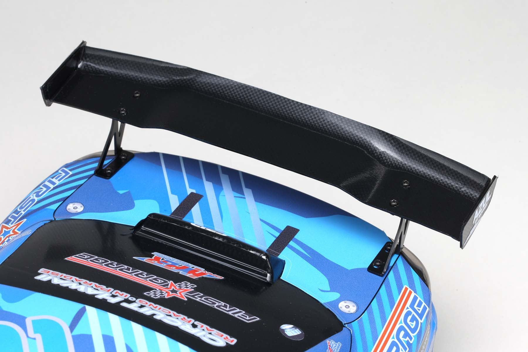 Close up wing stays of the MERCURY SAYAKA SPECIAL S15 body w/Light Decal made by Yokomo on a grey background
