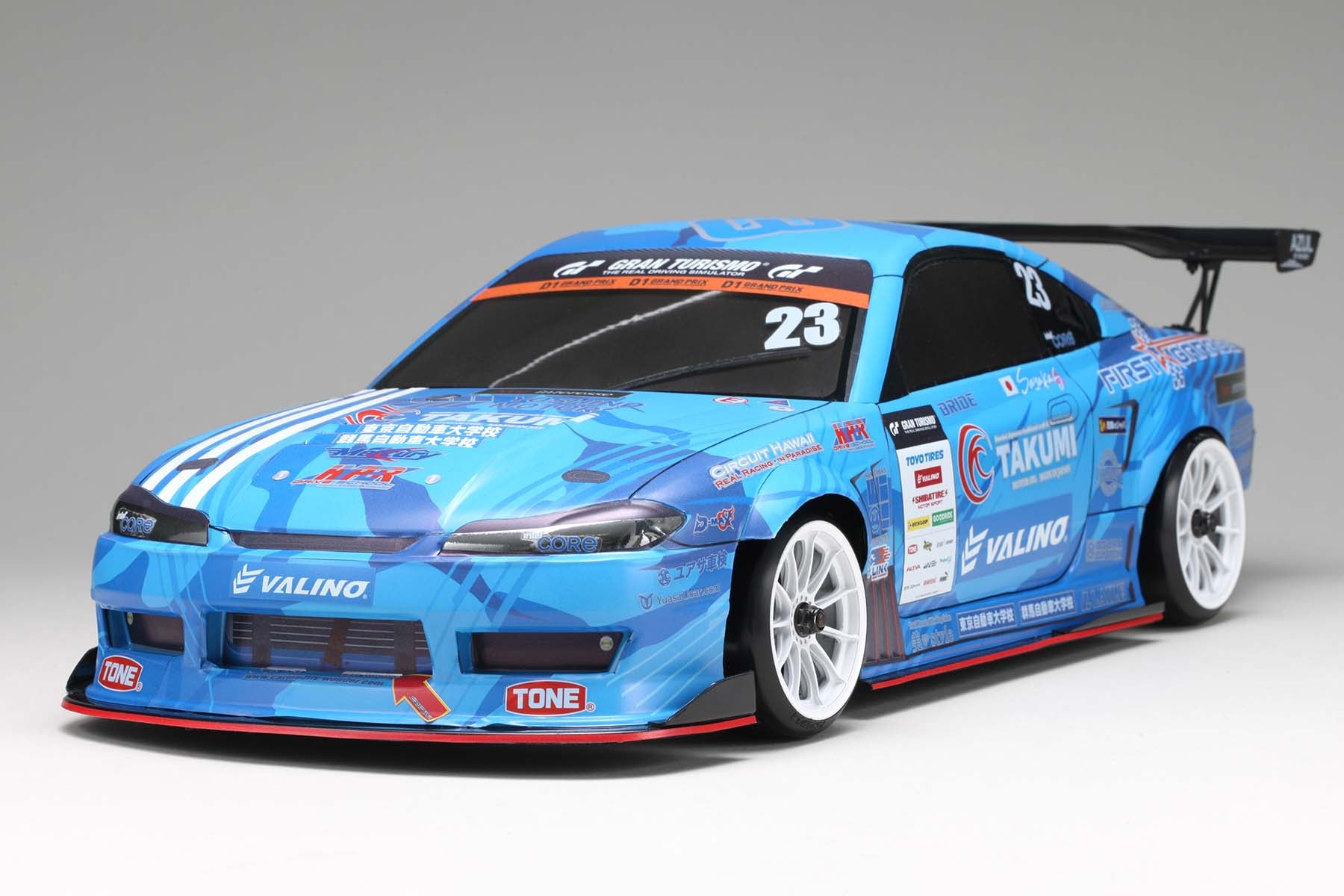A fully constructed front view of the MERCURY SAYAKA SPECIAL S15 body w/Light Decal made by Yokomo on a grey background
