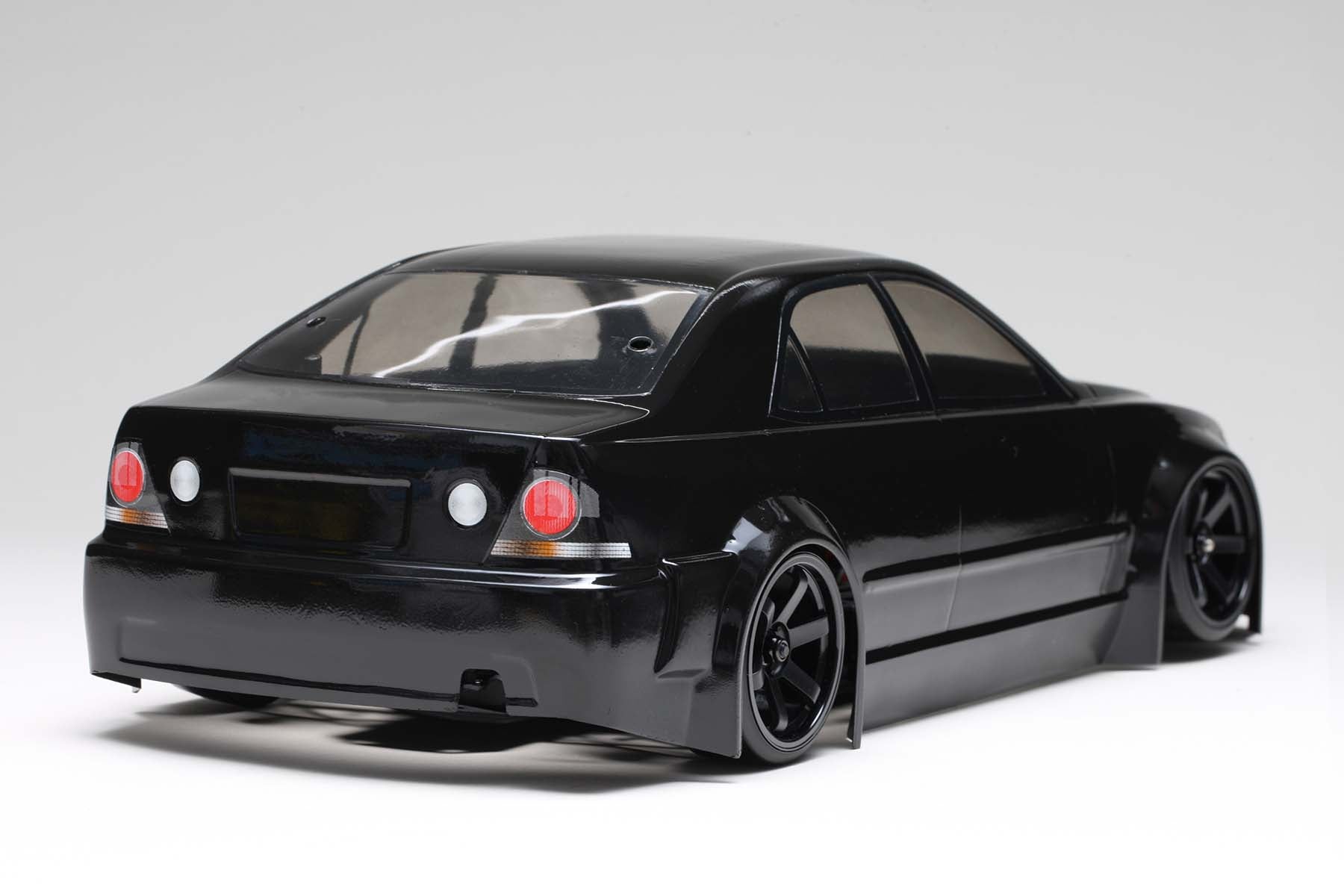 Back side view of a fully built IS220 Altezza Body w/Light Decal by Yokomo on a white background