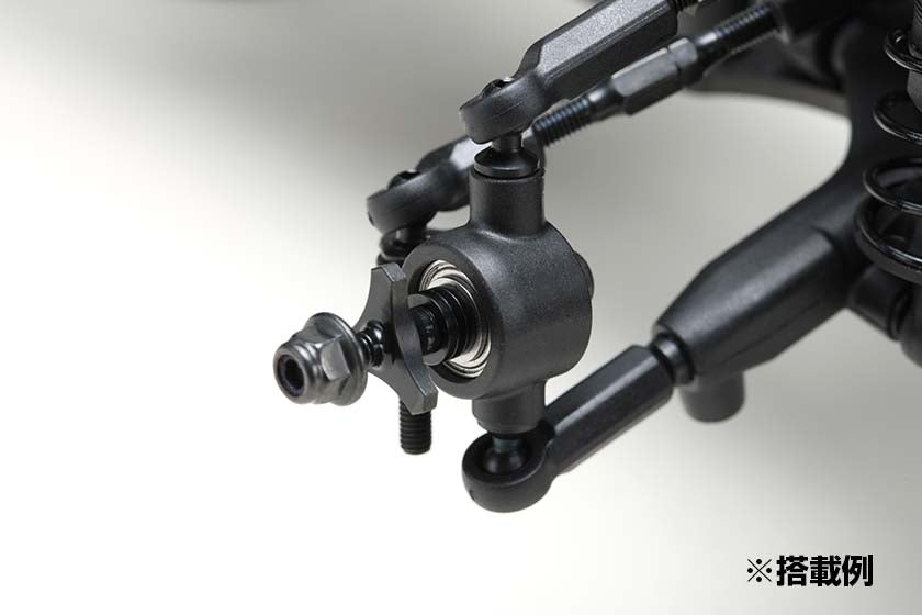 Close-up of the Yokomo Steel Double Bearing F.Axle Set for RD/SD/MD in use on a white background
